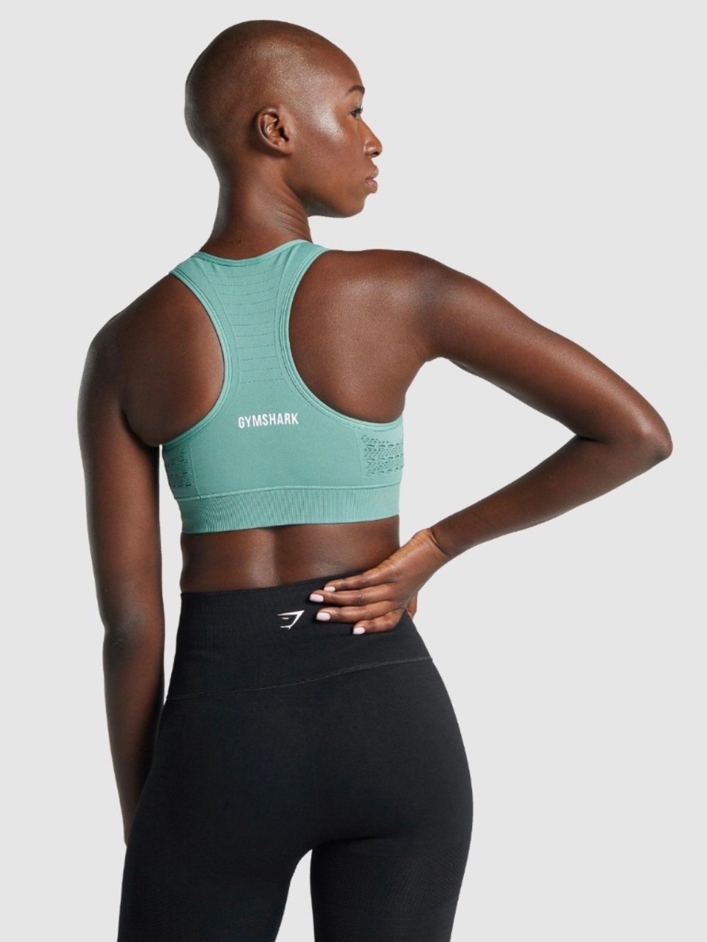 Gymshark seamless racerback sports bra in a muted sage/grey-green colour.